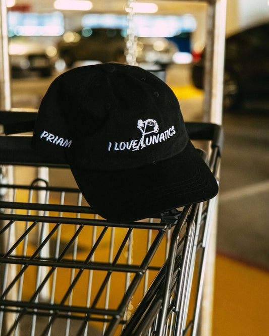 I LOVE LUNATICS Cap with skeleton graphic, PRIAM branding on the side, and 'F*** THEM' embroidered on the back.