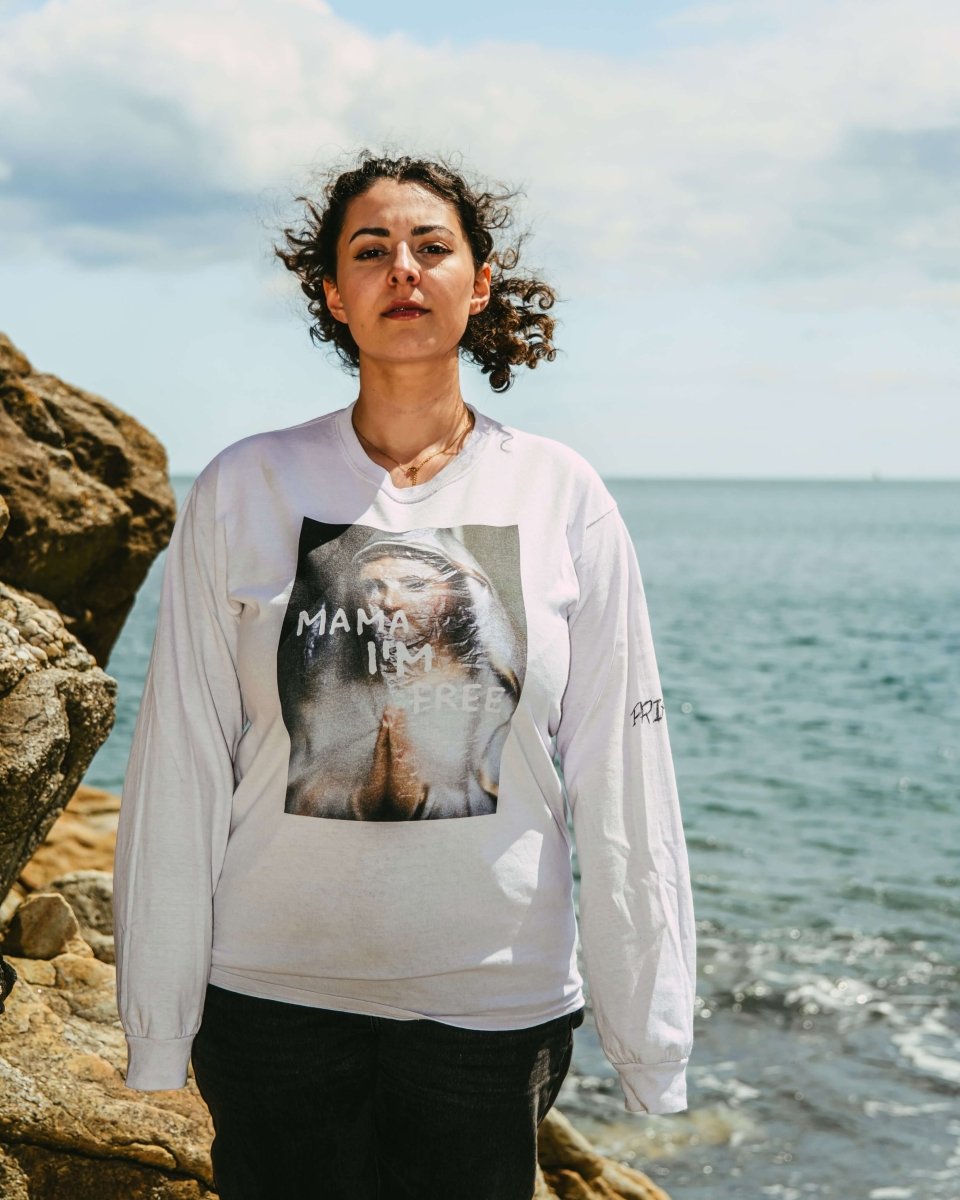 MAMA I’M FREE spiritual freedom graphic tee featuring a praying nun with "MAMA I’M FREE" painted in white, symbolizing liberation