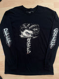 Black HATRED t-shirt with white graphic design and text on a wooden surface