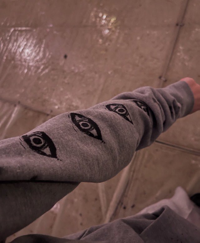 PARANOID grey hoodie with eye graphic symbolizing paranoia
